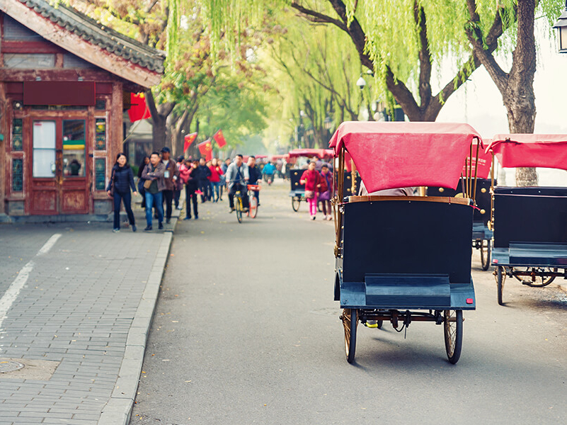 Rundfahrt in Beijing in einer traditionellen Rickshaw